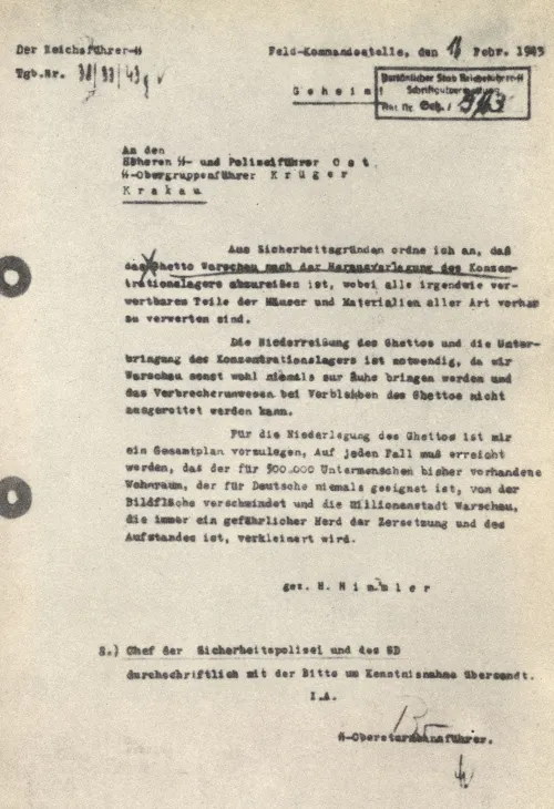 Schreibmaschinenschrift auf gealtertem grauem Papier mit handschriftlichen Korrekturen. Unten darunter steht: „gez. Himmler“